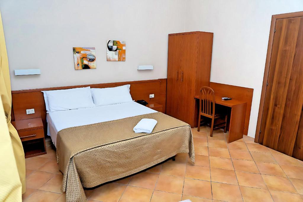 Postel nebo postele na pokoji v ubytování Hotel Cervia