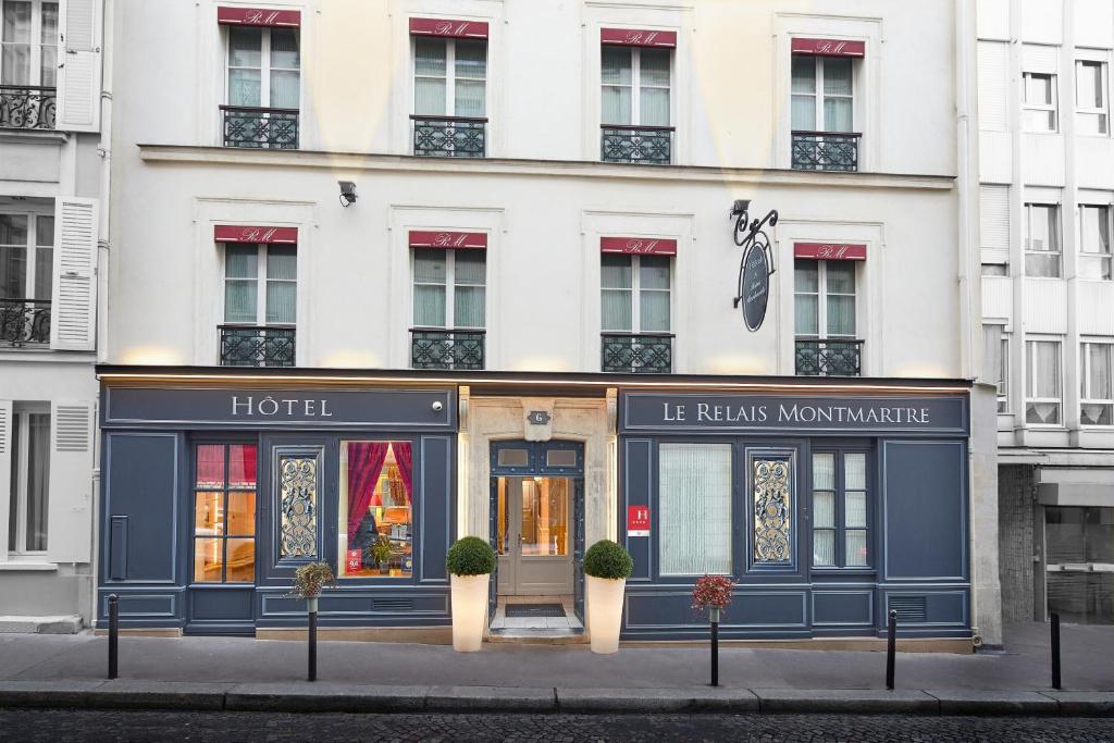 a store front of a hotel on a city street at Le Relais Montmartre in Paris