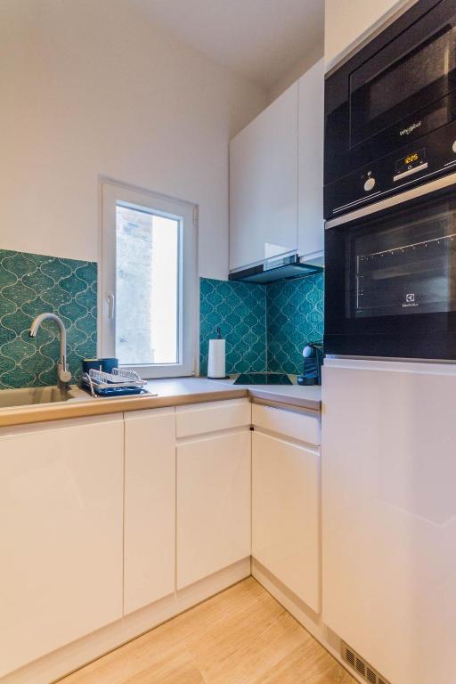 Kuchyňa alebo kuchynka v ubytovaní Chain Bridge Studio Apartment