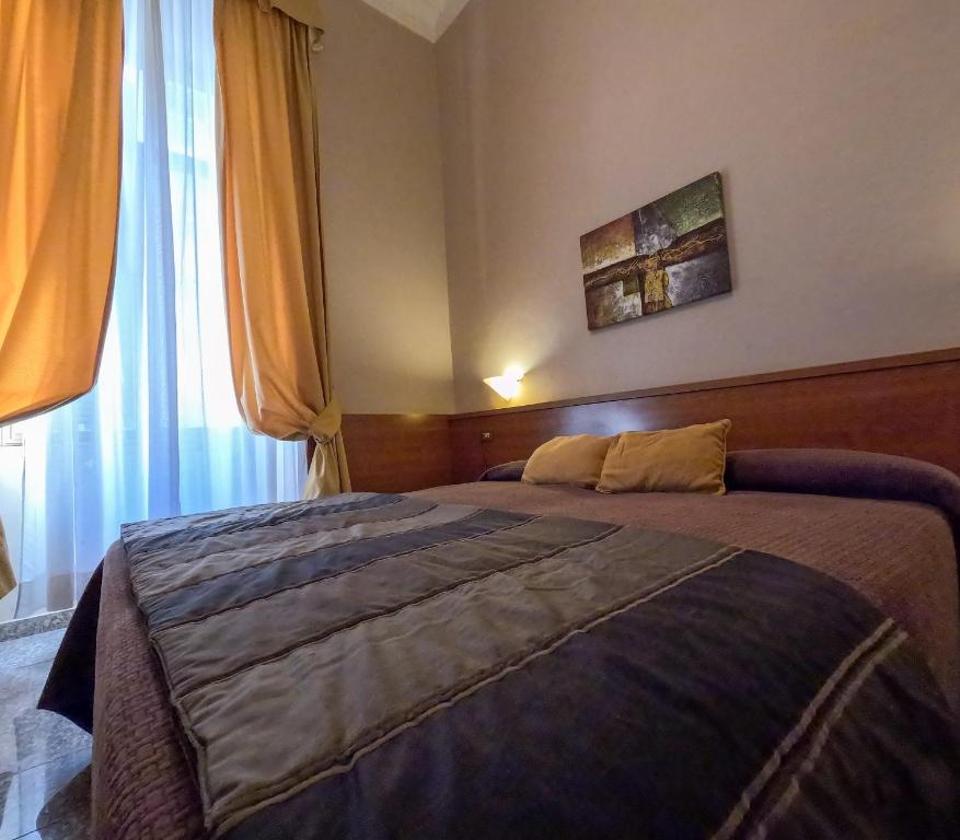 Postel nebo postele na pokoji v ubytování Hotel Cervia