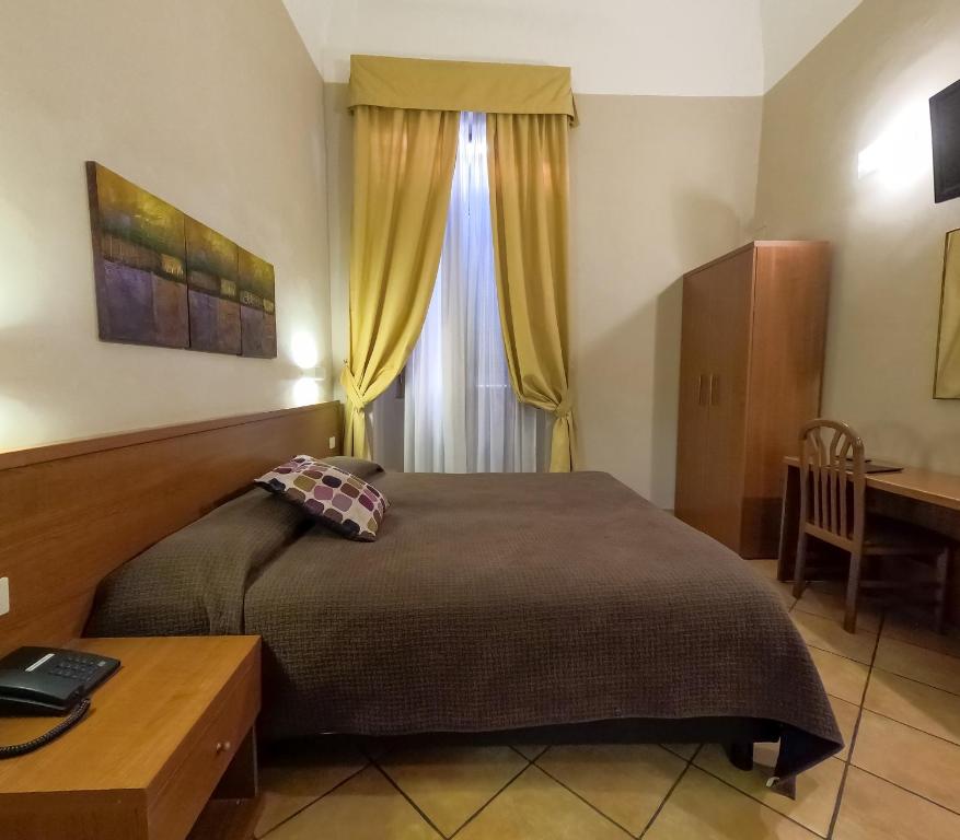 Postel nebo postele na pokoji v ubytování Hotel Cervia