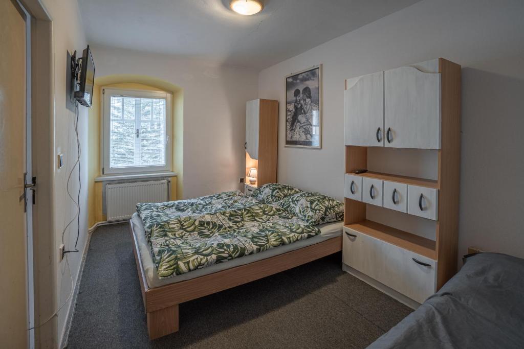 Postel nebo postele na pokoji v ubytování Apartmá u Baštů
