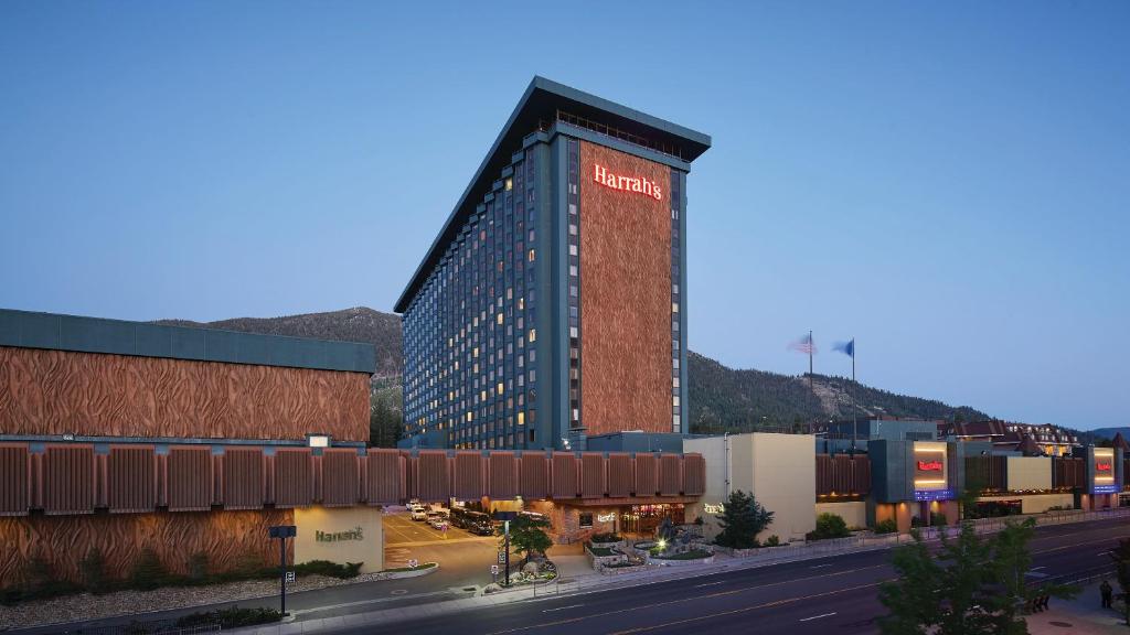 a tall building with a sign on it next to a street at Harrah's Lake Tahoe Hotel & Casino in Stateline