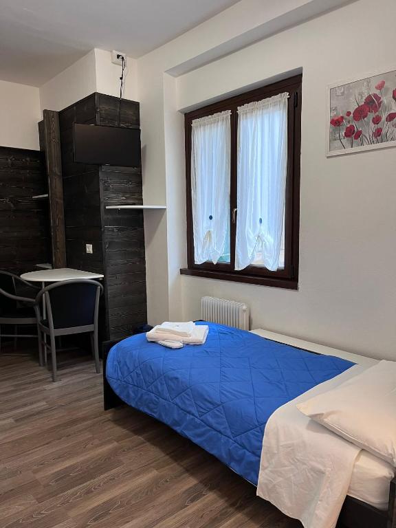 Postel nebo postele na pokoji v ubytování Albergo Baffo