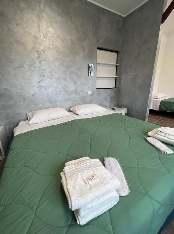 Postel nebo postele na pokoji v ubytování Albergo Baffo