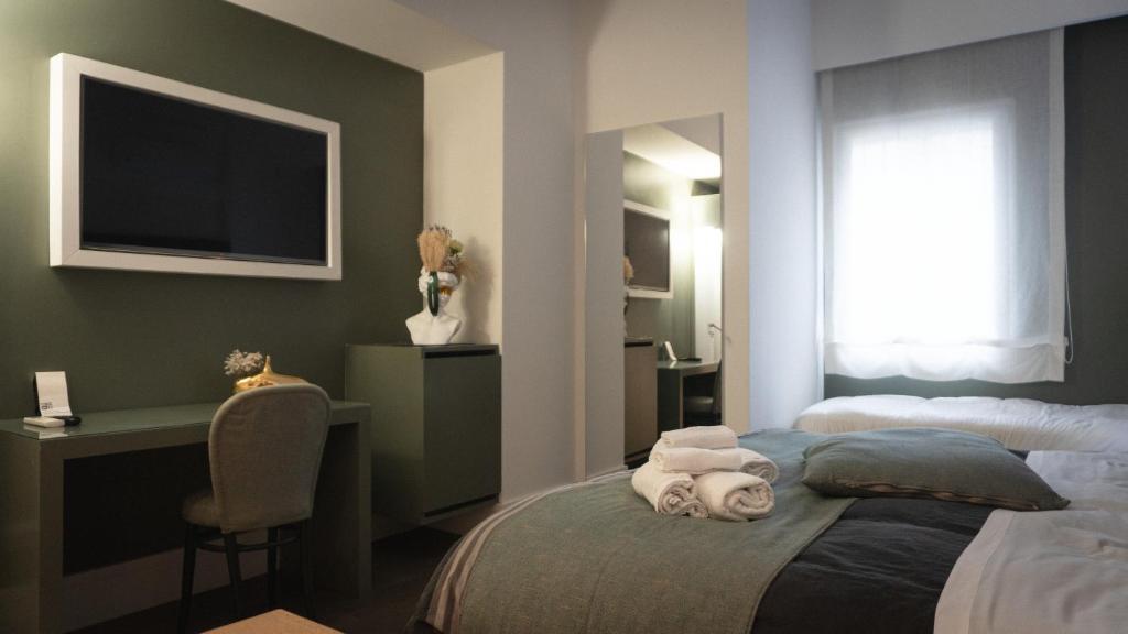 Postel nebo postele na pokoji v ubytování XENIA LUXURY ROOMS