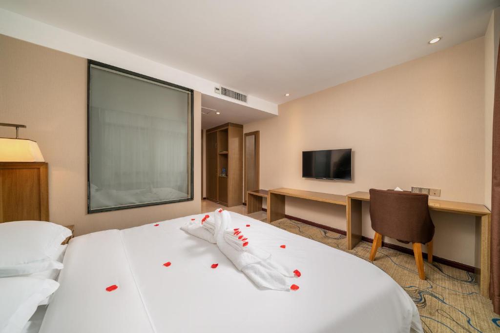 TV a/nebo společenská místnost v ubytování Guangzhou Boyi Hotel