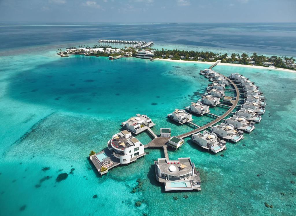 an aerial view of a resort in the maldives at Jumeirah Maldives, Olhahali Island in North Male Atoll