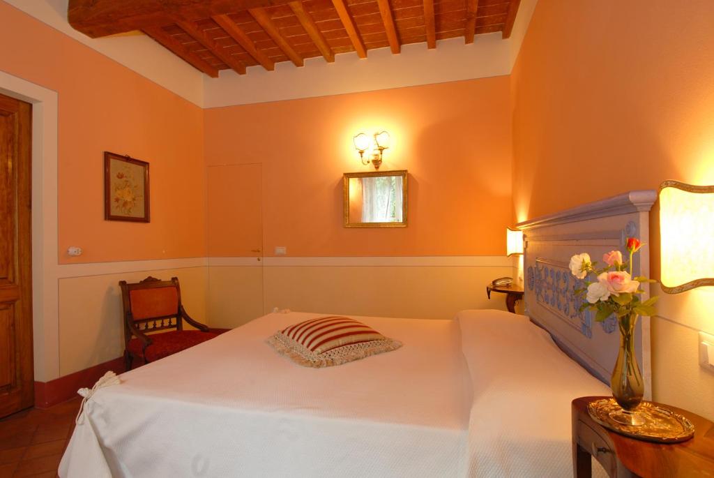 Postel nebo postele na pokoji v ubytování Il Rondò Boutique Hotel