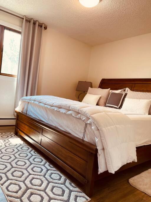 a bedroom with a bed with a laptop on it at North Star Place 11 in Fairbanks