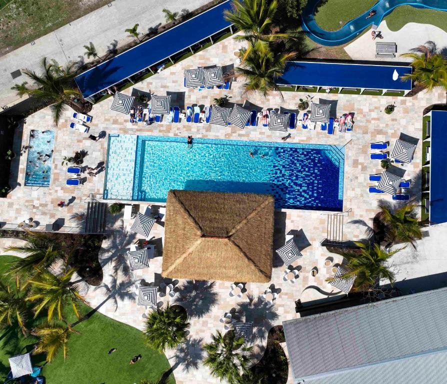 an overhead view of a swimming pool at a resort at BIG4 Sandstone Point Holiday Resort Bribie Island in Bongaree