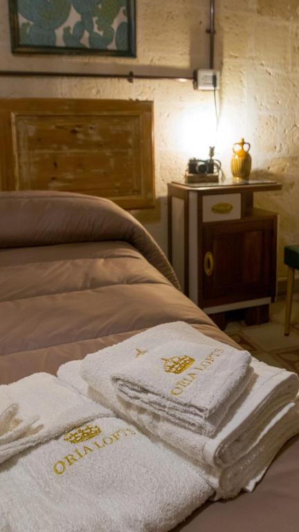 Postel nebo postele na pokoji v ubytování Oria Lofts