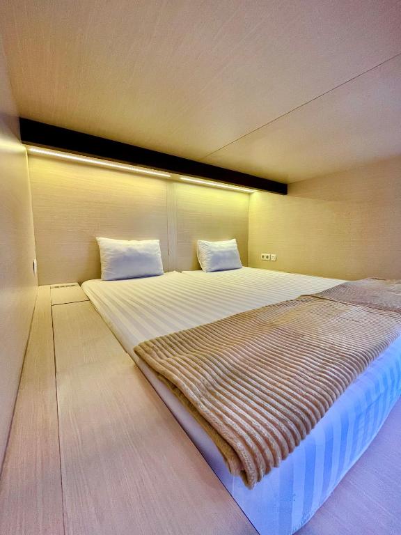 Postel nebo postele na pokoji v ubytování Best Canggu Hostel