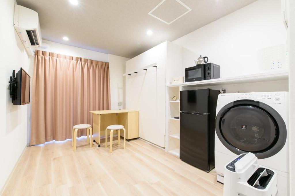 Kuchyň nebo kuchyňský kout v ubytování JP INN Kyoto Ekimae Izutsucho