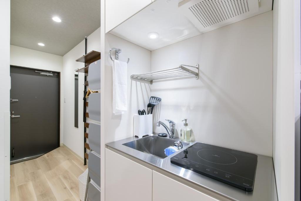 Kuchyň nebo kuchyňský kout v ubytování JP INN Kyoto Ekimae Izutsucho