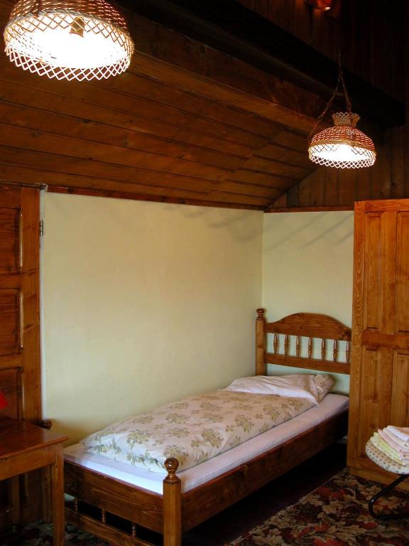Postel nebo postele na pokoji v ubytování Pensiunea Sub Cetate Deva