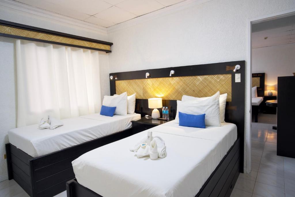 Postel nebo postele na pokoji v ubytování Dao Diamond Hotel & Restaurant