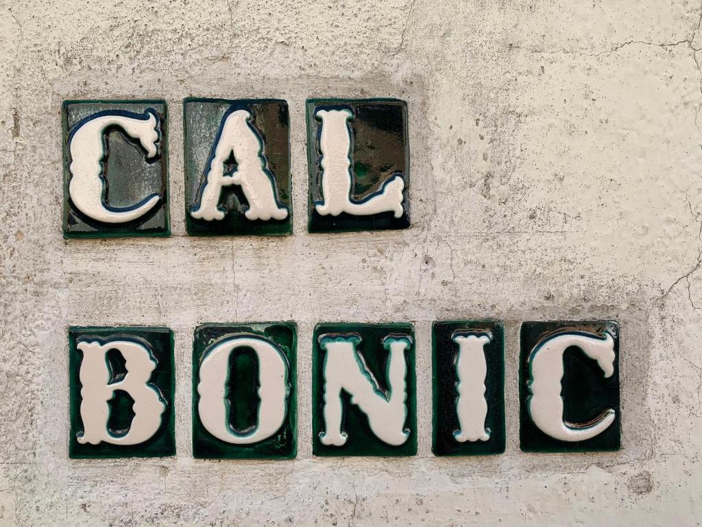 a sign on a wall with the words car bonanza at Cal Bonic in Riudarenes