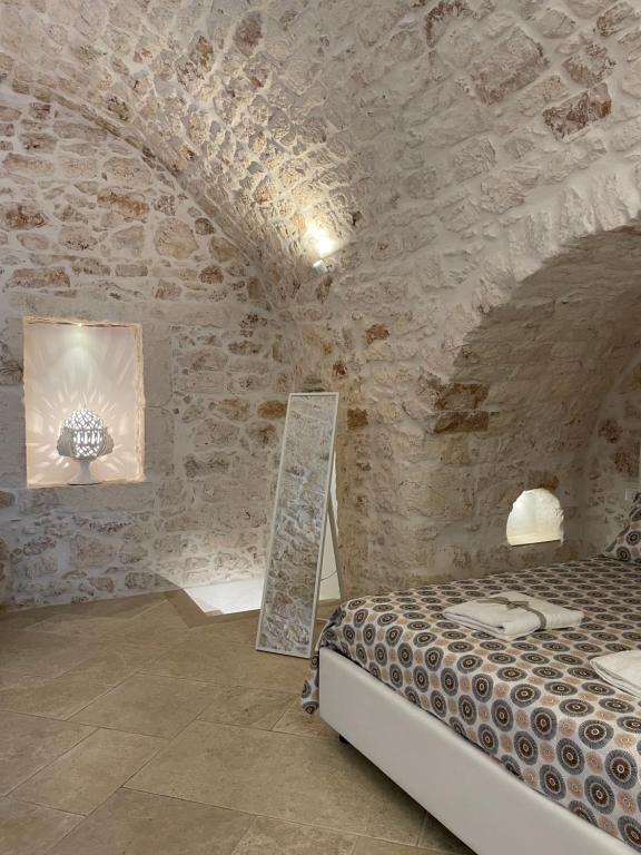 Łóżko lub łóżka w pokoju w obiekcie white room Ostuni
