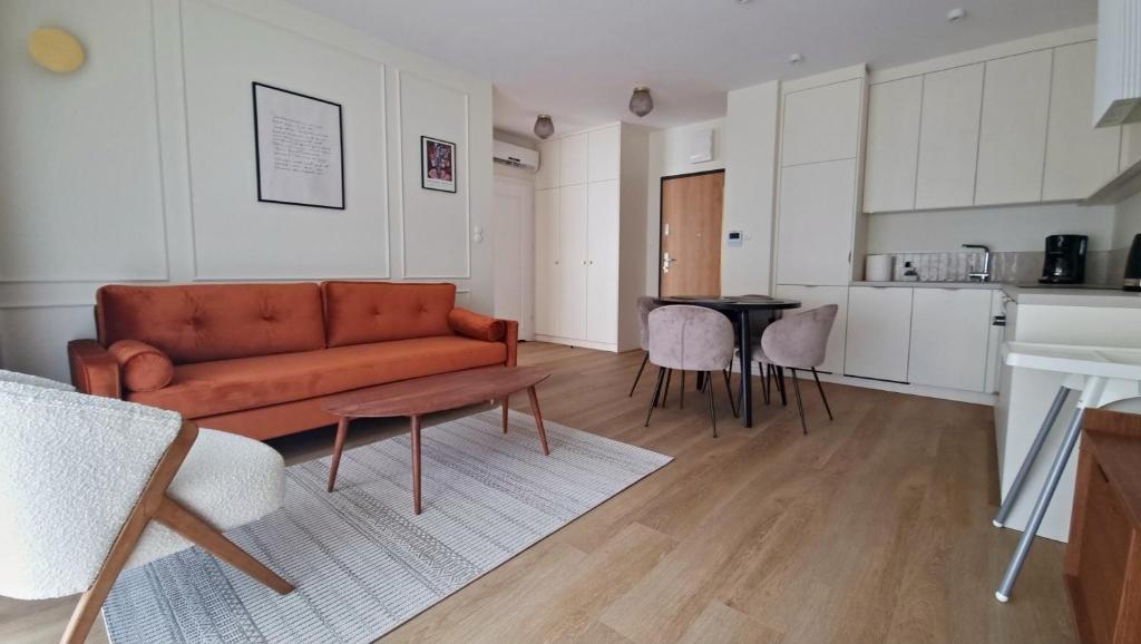 a living room with a couch and a table at Apartament Lublin Centrum "Angora Cat" in Lublin