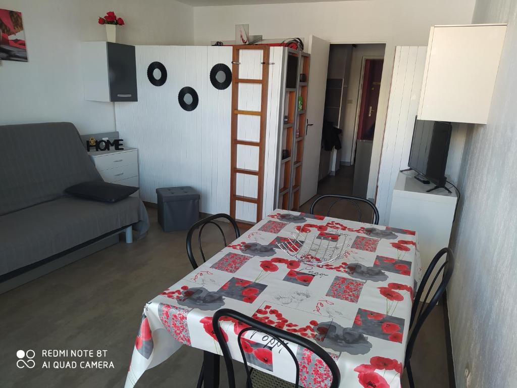 a room with a table with a table cloth on it at Studio superdevoluy in Le Dévoluy