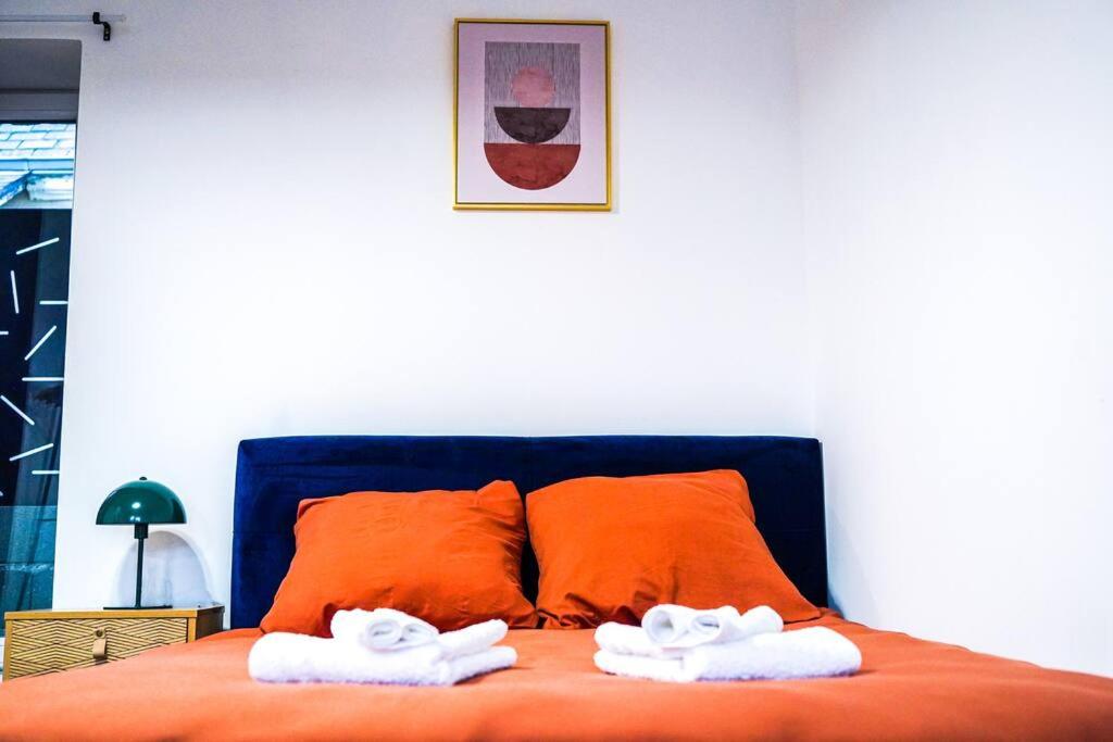 Postel nebo postele na pokoji v ubytování Le Petit Faubourg • Fibre • Proche Centre-Ville