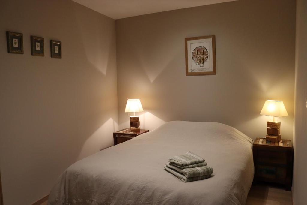 Posteľ alebo postele v izbe v ubytovaní Gîte des Potiers