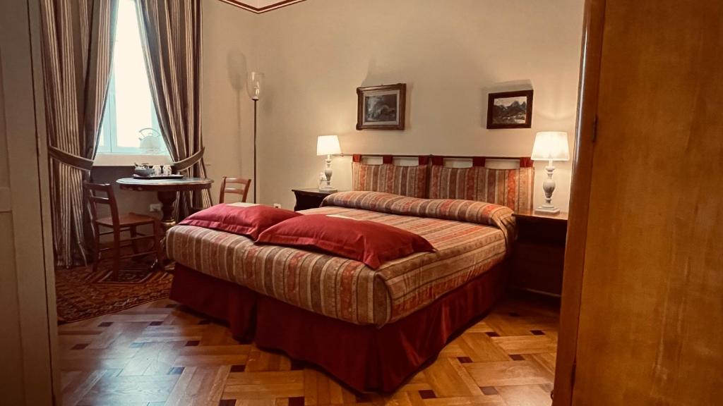 Postel nebo postele na pokoji v ubytování Residenza Le 6 A