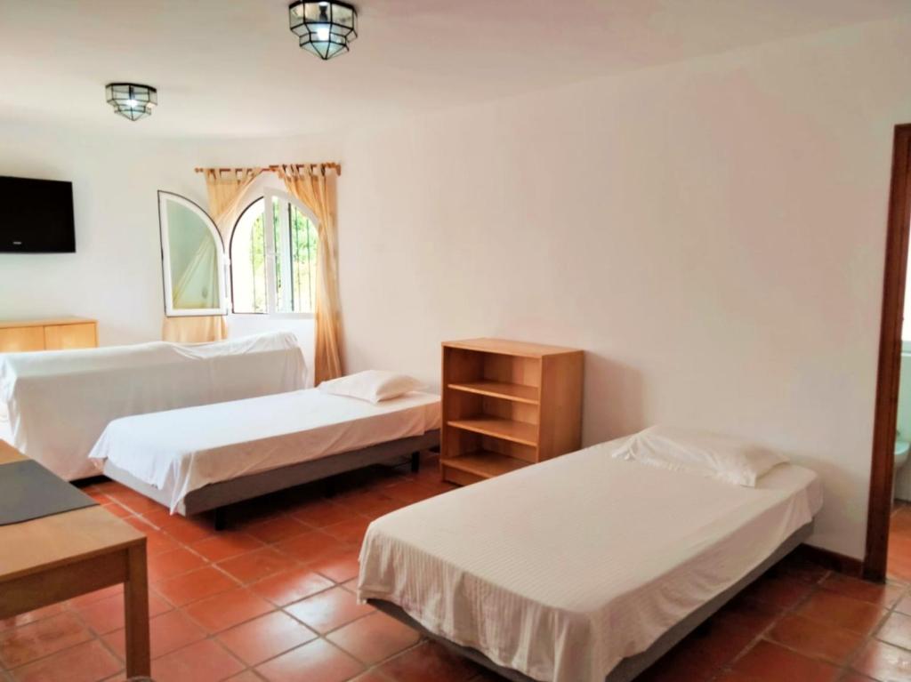Postel nebo postele na pokoji v ubytování Villa 56