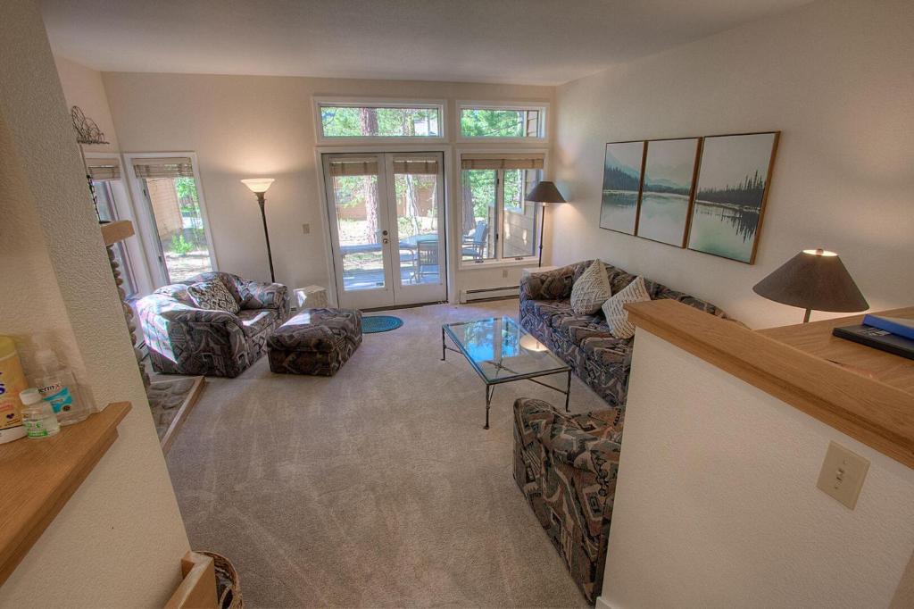 a living room with couches and a table at Delightful McCloud condo in Incline Village