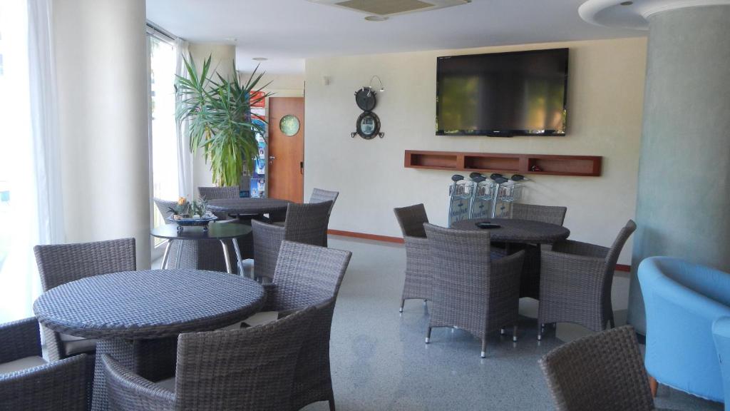 TV a/nebo společenská místnost v ubytování Hotel Pari
