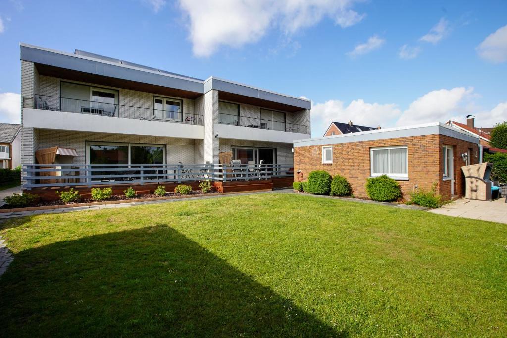 a large house with a lawn in front of it at Haus Spökenkieker in Borkum