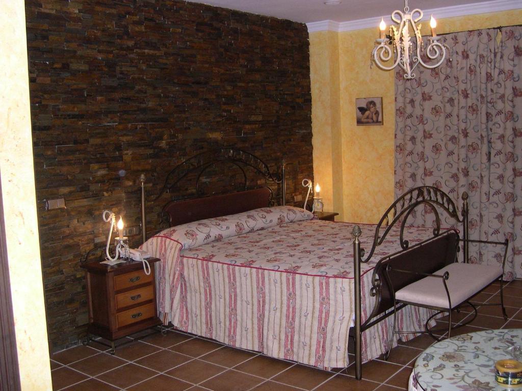 Postel nebo postele na pokoji v ubytování Hotel El Doncel