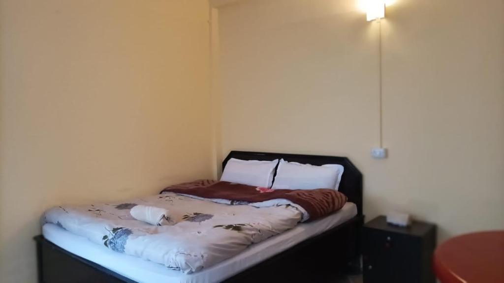 Postel nebo postele na pokoji v ubytování Banabas Homestay