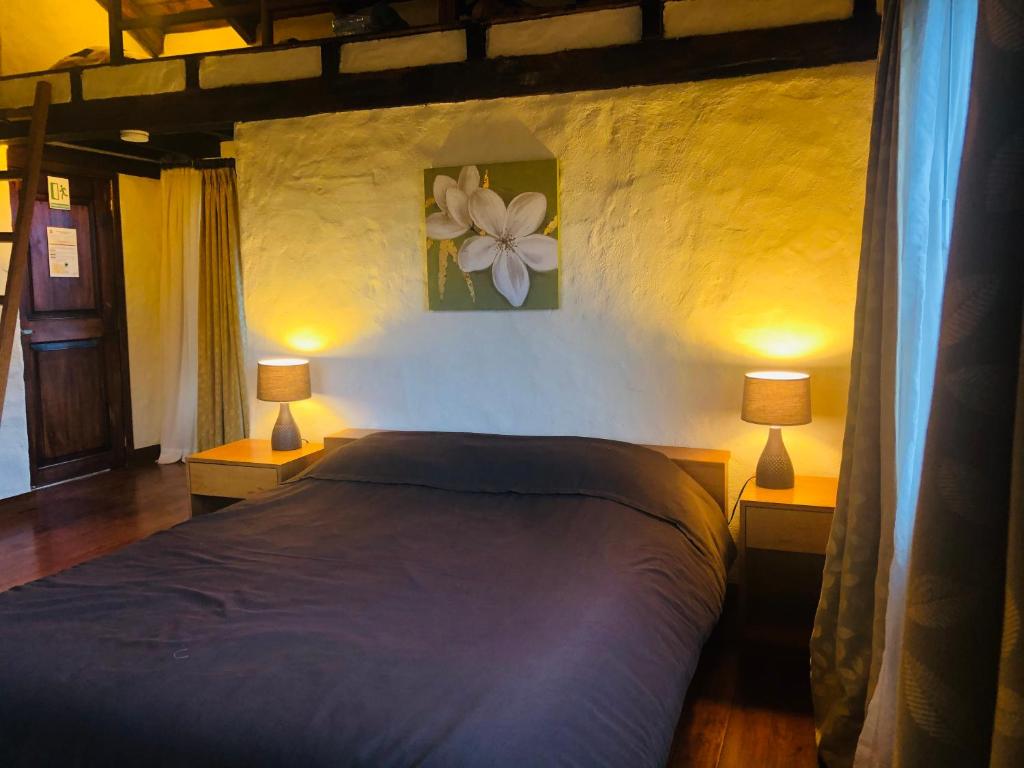 Postel nebo postele na pokoji v ubytování Hotel Tambopaxi