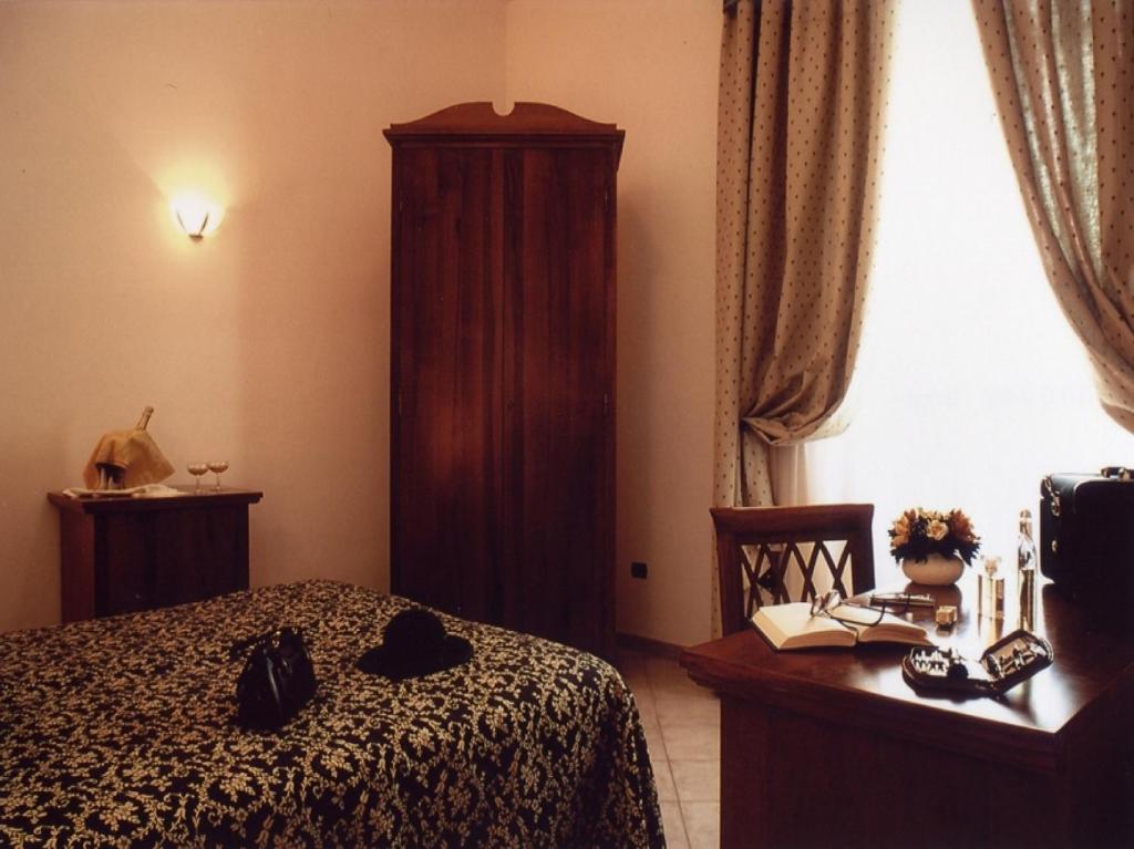 Postel nebo postele na pokoji v ubytování Hotel Il Cavalier D'Arpino