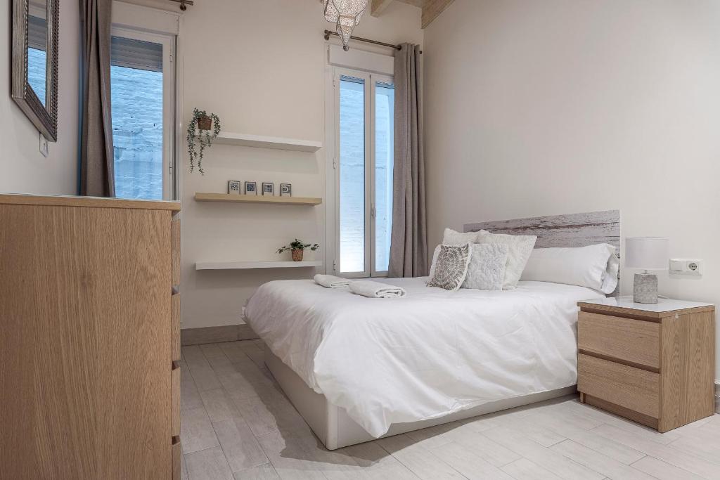 Llit o llits en una habitació de Julio Cesar Gran Apartamento de lujo en el centro de Sevilla