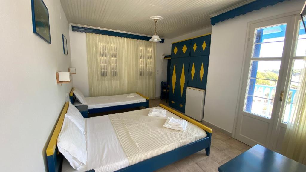 Postel nebo postele na pokoji v ubytování Galini Hellenic Hospitality