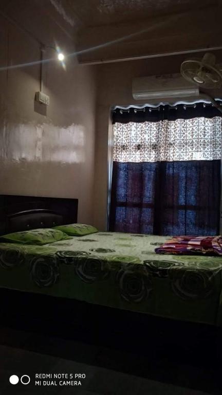 Postel nebo postele na pokoji v ubytování Shree Savitri Palace