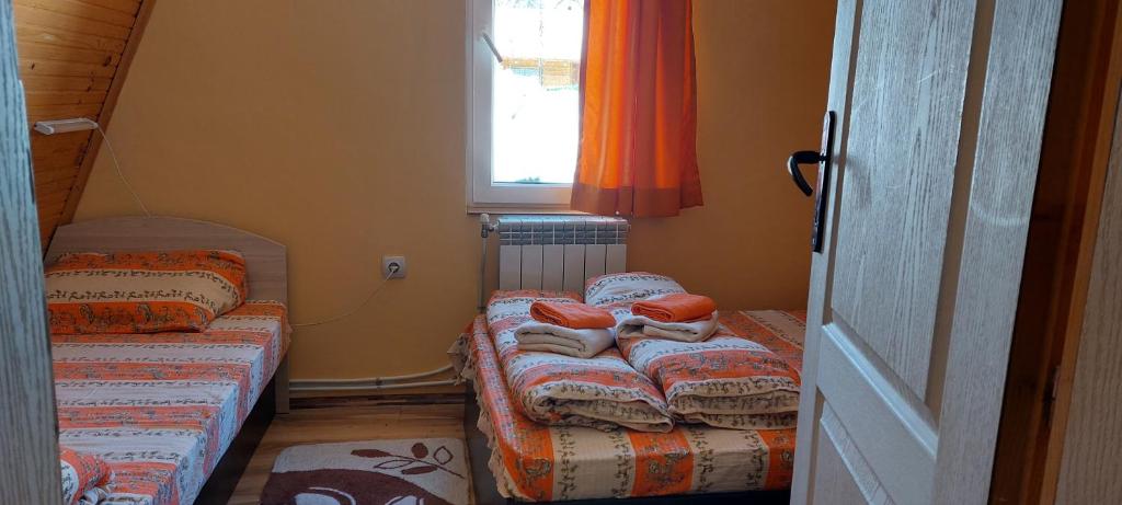 Postel nebo postele na pokoji v ubytování Vili Bilyana