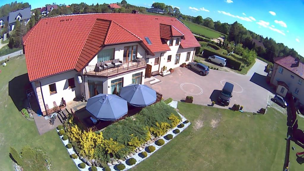 an aerial view of a house with a red roof at Agro Nad Stawem in Żukowo