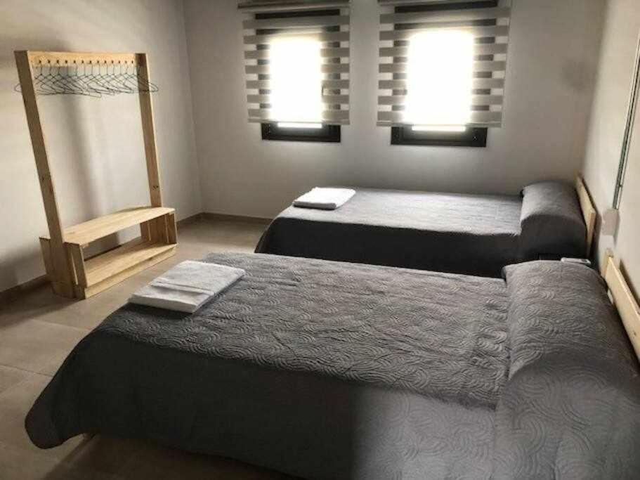 Postel nebo postele na pokoji v ubytování Alojamiento El Pez Casa con piscina climatizada