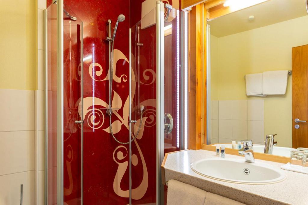 Koupelna v ubytování Biobausewein WEIN HOTEL LEBEN