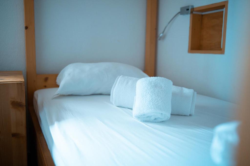 Postel nebo postele na pokoji v ubytování Wax Hostel