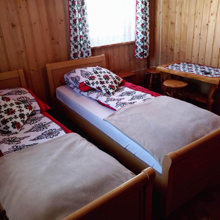 Posteľ alebo postele v izbe v ubytovaní Agroturystyka u Marii