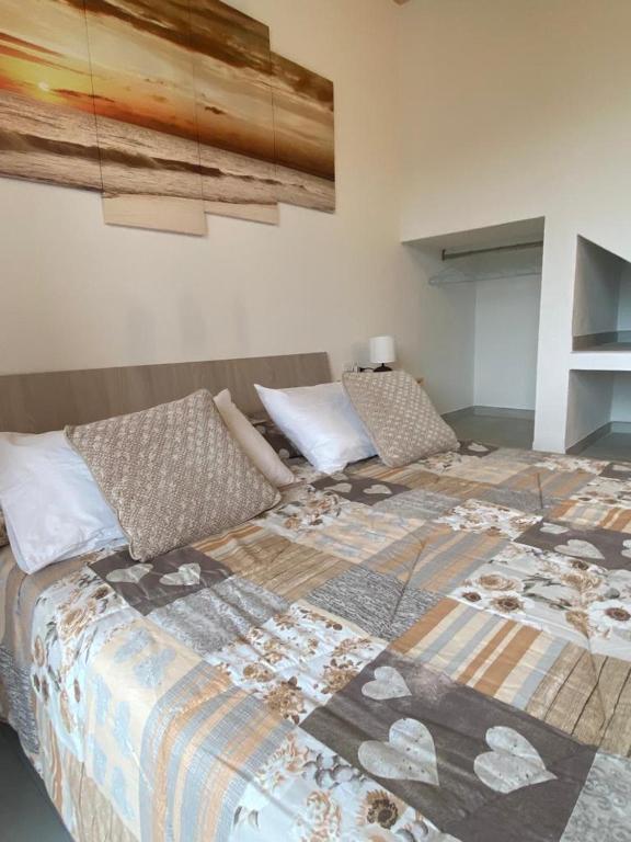 A bed or beds in a room at Monolocale V.M 0.23