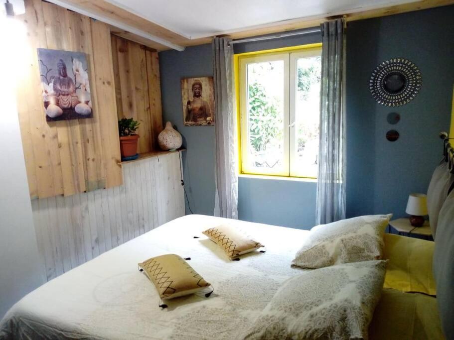 Postel nebo postele na pokoji v ubytování Kaz nature, mon zarlor