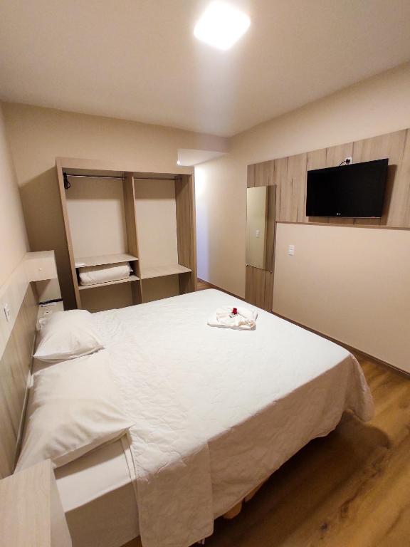 Postel nebo postele na pokoji v ubytování Harbor Querência Hotel