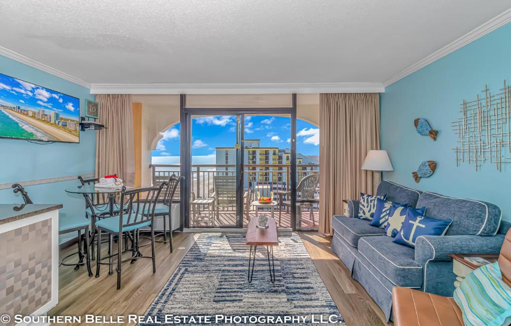 a living room with a couch and a table at Ocean View Double Suite with Beautiful Decor and Accents Caravelle Resort 1504 Sleeps 6 Guests in Myrtle Beach