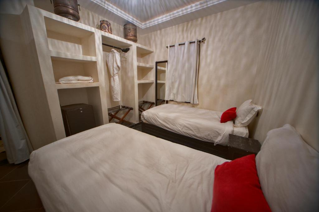 Postel nebo postele na pokoji v ubytování Riad Tama & spa